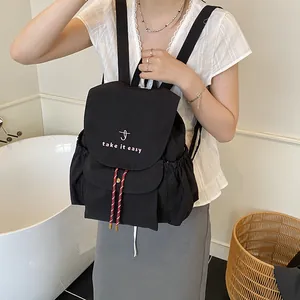 Fashionable black drawstring bucket backpack with pink embroidery and red accent ropes