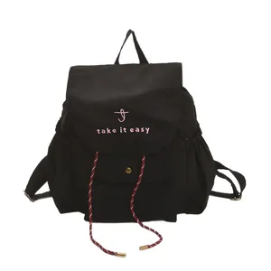 Black canvas bucket backpack featuring pink embroidery and colorful drawstrings