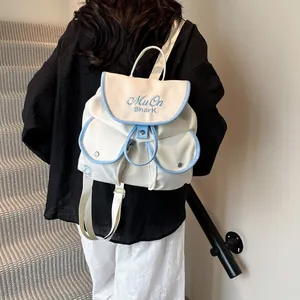 Minimalist white and blue contrast nylon backpack with cute bear embroidery for daily use