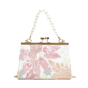 Elegant shell bag with sequined floral embroidery, pearl handle and gold chain strap