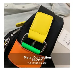 Detailed close-up of the metal connection buckle and colorful nylon stitching on the bag