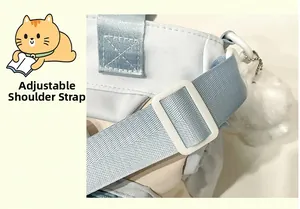 Detail view of the adjustable light blue nylon shoulder strap with white plastic buckle