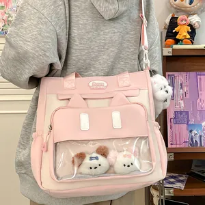 Cute pink and beige cat-ear ita bag with transparent window and plush puppies