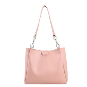 Minimalist light pink PU leather tote bag with silver chain straps and vertical stitching