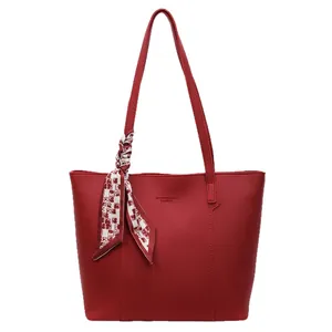 Deep red large tote bag with lychee texture, shoulder straps and decorative silk scarf