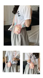 Detailed view of pink transparent PVC bucket bag with plush bunny and mint green bead strap