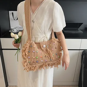 Bohemian hand-woven shoulder tote bag with colorful beads, tassels and wide strap details