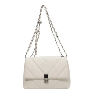 Elegant white quilted chain crossbody bag with adjustable gold ball and metal turn-lock