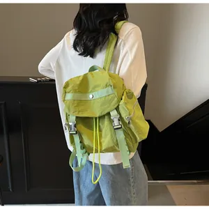 Side view of lime green lightweight nylon backpack showing side zipper pocket and buckle
