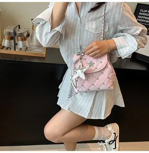 Pink quilted leather bag featuring silver star pendants and studded metal chain strap
