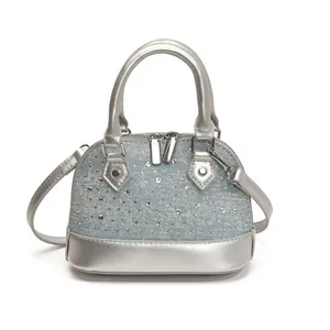 Mini rhinestone shell handbag in light blue denim with silver handles and shoulder strap