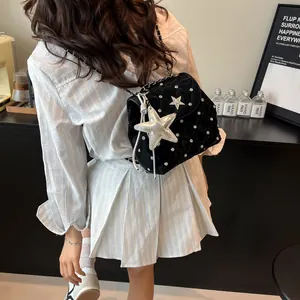 Quilted black chain bag with silver star charm and rhinestone accents for women
