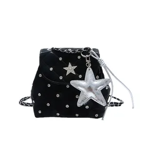 Black quilted shoulder bag with silver star pendants and elegant chain strap