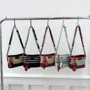 Chic woven straw bucket bags in five colors with chain straps and strawberry charms