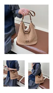Detailed macro view of hollow out knit bag featuring leather straps and metal buckles