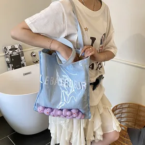 Sac fourre-tout transparent minimaliste avec intérieur en toile bleue et lettrage