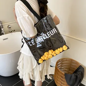 Sac cabas noir transparent avec canards jaunes à l'intérieur et imprimé Le Bateleur