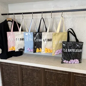 Sac fourre-tout en PVC transparent avec mini canards colorés et texte LE BATELEUR