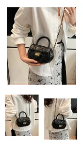 Detail of black quilted leather mini bag featuring gold turn-lock and chain strap