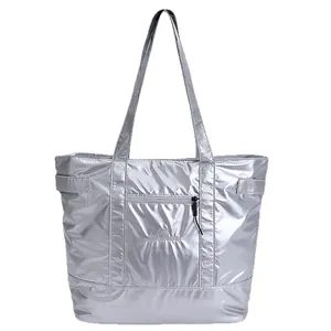 Large silver tote bag with metallic finish, double handles and front zipper pocket