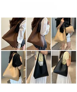 Detail view of large capacity minimalist tote bag shown with matching clutch in various colors
