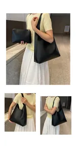 Detail of black leather tote bag set including large shoulder bag and small inner pouch