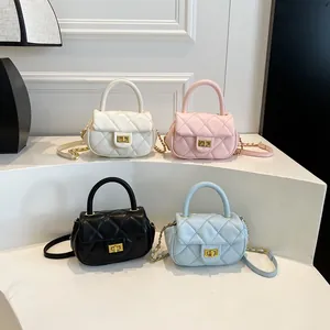 Minimalist quilted crossbody chain bags in four pastel colors on a stylish display