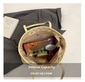 Top view showing large capacity and internal pockets of the beige cartoon tote bag
