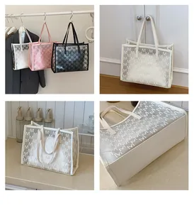 Detail of transparent jelly tote bag with M letter prints and leather trim borders