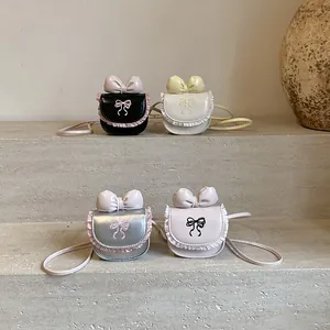 Mini lace kids crossbody bags with bow embroidery in black, white, silver, and pink
