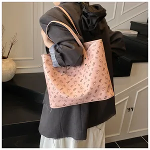 Pink tote bag with bear print shown on shoulder for daily office commuting style