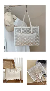 Close-up of clear PVC tote bag with white letter patterns and cream handle details