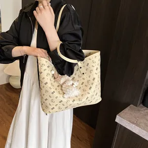 Chic cream tote bag with bear patterns and plush charm for daily office commute
