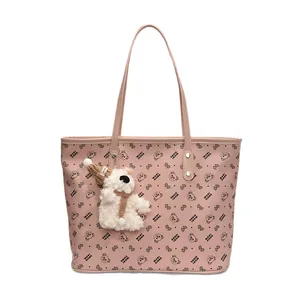 Pink tote bag with bear print and plush bear charm for daily commute and office wear