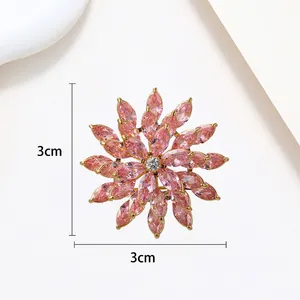 Detailed view of rotating snowflake brooch with pink crystals and 3cm dimension scale