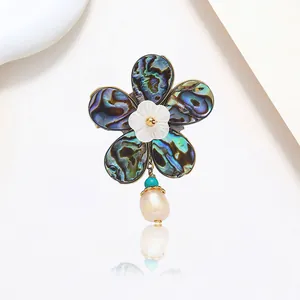 Elegant floral brooch with abalone shell petals and baroque freshwater pearl drop