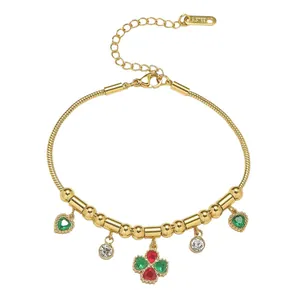 Bracelet en acier titane doré avec charmes en zircone cubique et pendentifs cœur