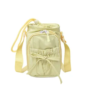 Lichtgele crossbody telefoontas met strikdecoratie en verstelbare geweven schouderband