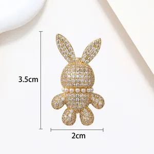 Detail showing the 3.5cm by 2cm dimensions of the pearl rabbit brooch with gold base