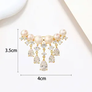 Detailed view of elegant pearl brooch with rhinestones showing dimensions 3.5cm by 4cm