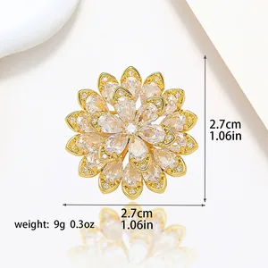 Detailed view of the 2.7cm gold flower brooch with sparkling zircon and dimensions info