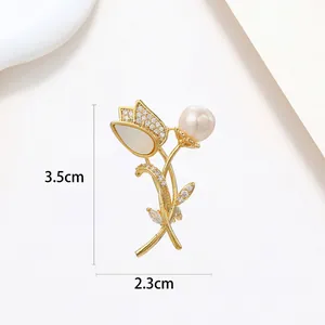 Detailed view of tulip brooch with white opal petals and pearl measuring 3.5cm by 2.3cm