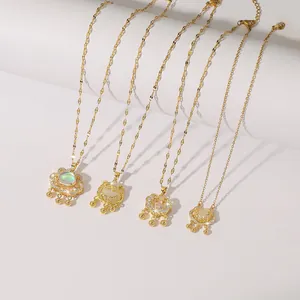 Detailed view of four golden Ruyi lock necklaces with bells and opal stone inlays