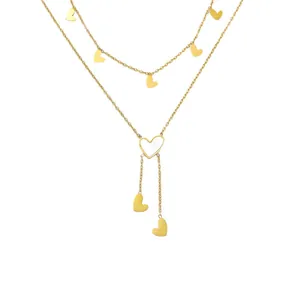 Collier double rang doré avec pendentifs cœurs, incrustation nacrée et chaînes pendantes