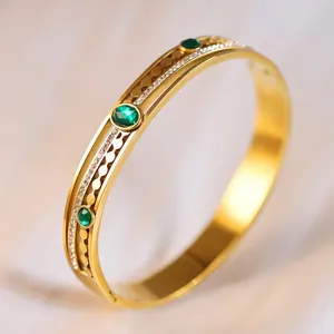 Elegant gold-plated stainless steel bracelet with green stones and zircon accents