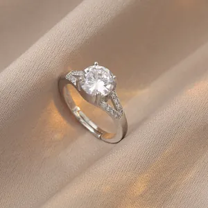 Close-up of a 1-carat round brilliant solitaire ring with V-shaped split shank detail