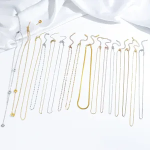 Detailed close-up of various 18K gold-plated stainless steel chains and textures