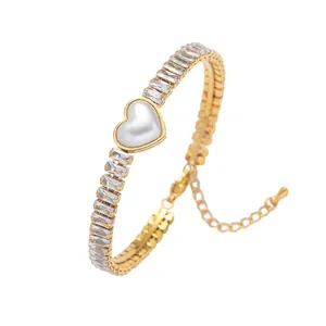 Gold plated stainless steel bracelet with rectangular zircons and heart pearl charm