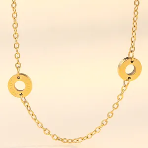 Detailed view of 18K gold plated stainless steel chain with engraved Beauty pendants
