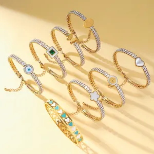 Gold-plated stainless steel tennis bracelets with crystal charms and evil eye bangle
